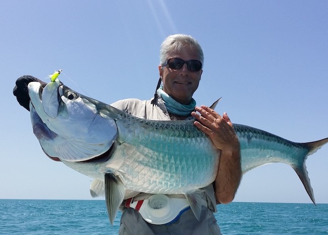 Zac showing the rest of the group his big fish in Ascension Bay.