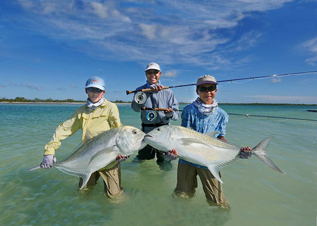 Aaron and his kids showing off the catch of the day in Cozumel.