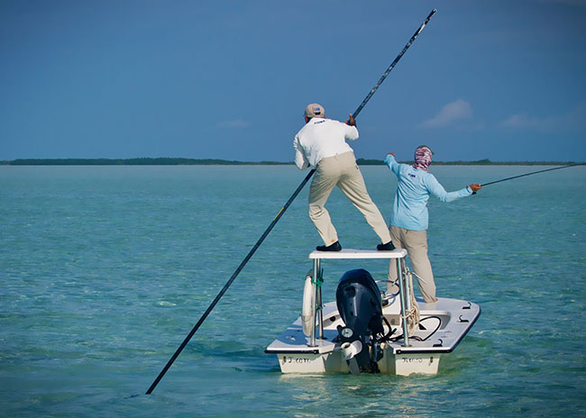 Rigoberto being oriented by his tour guide to fish the next game during his fly fishing tour.