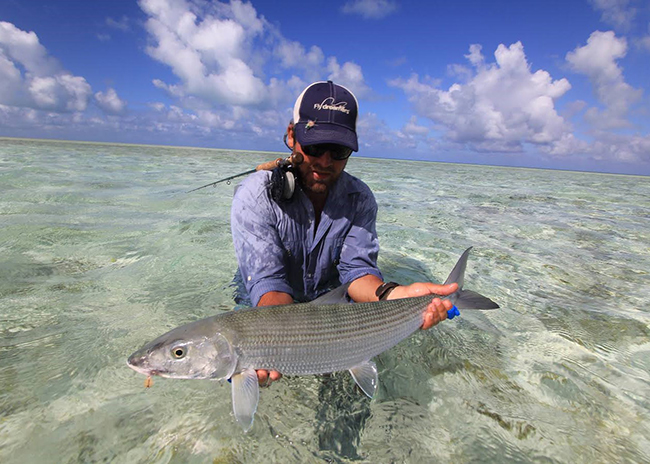 Brian very satisfied pulling off the fish he caught over the shallow waters of Cozumel.